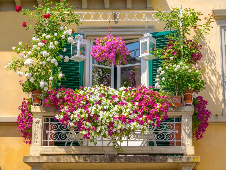 Italian house with windows balcony decorated with many colorful