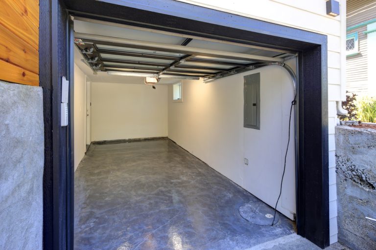 Empty garage interior with open door.