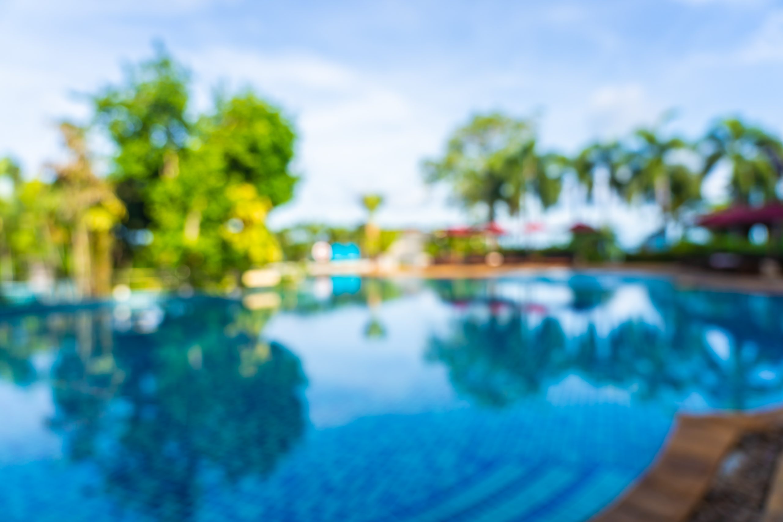 Abstract blur and defocus beautiful outdoor swimming pool in hot